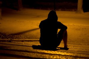 man’s silhouette sitting