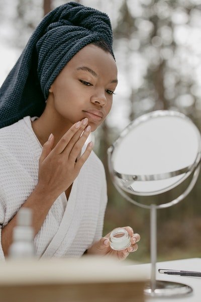 woman looking in the mirror