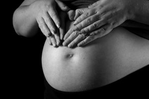 pregnant belly couple