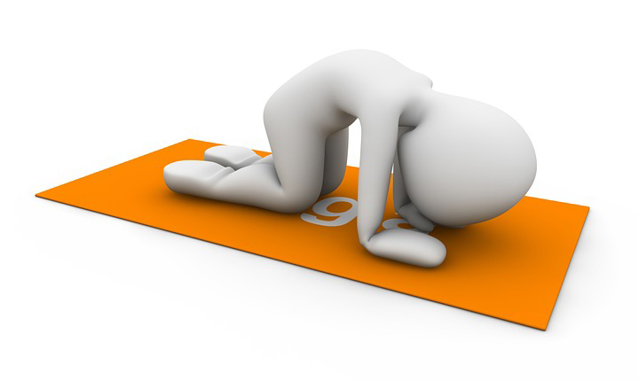 pregnant woman on a pilates ball