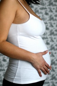 pregnant woman with hand on belly